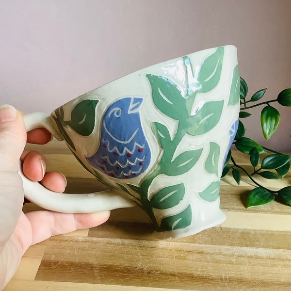 Handmade stoneware sgraffito lilac bird mug 