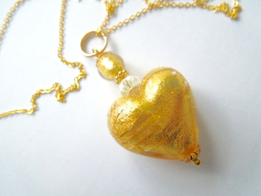 Gold Murano glass heart pendant with Swarovski crystal and gold chain.