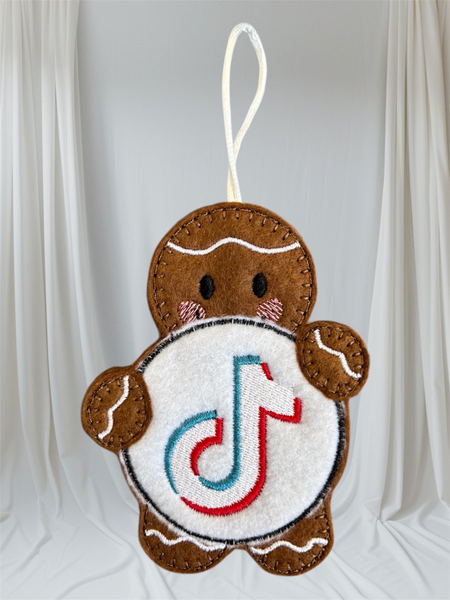 Gingerbread man holding a TikTok sign Embroidered Hanging Keepsake 