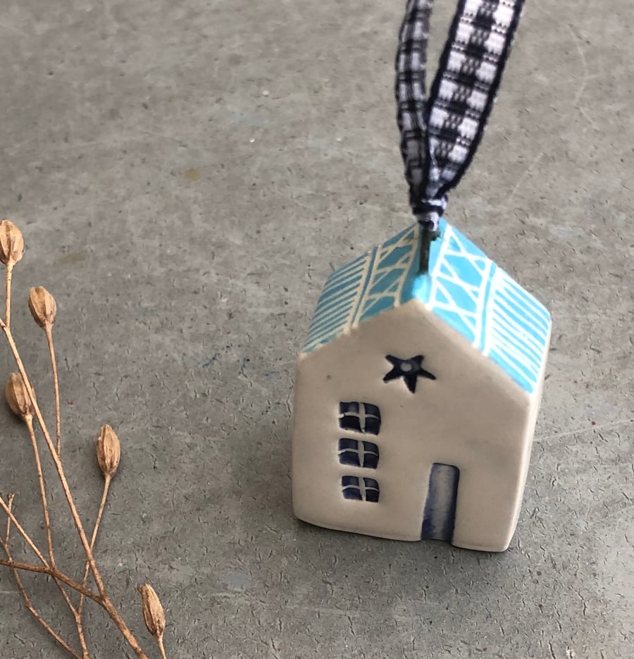 Ceramic hanging house decoration .