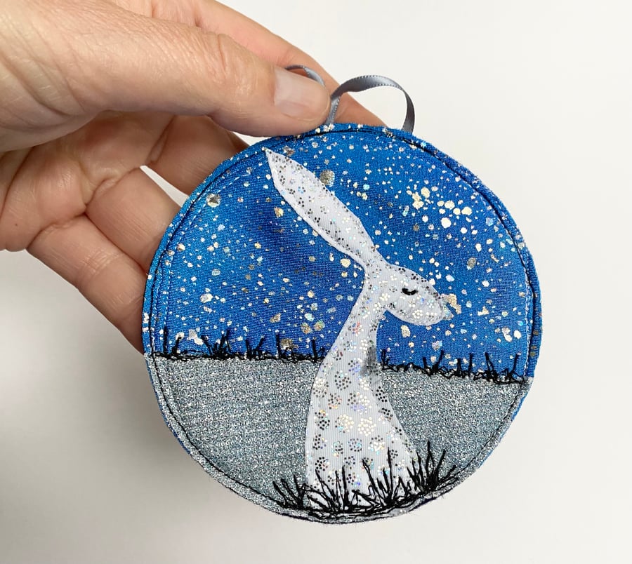 Upcycled embroidered winter hare home decoration. 