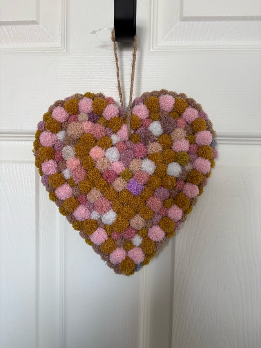 Wool Pom Pom filled heart. 