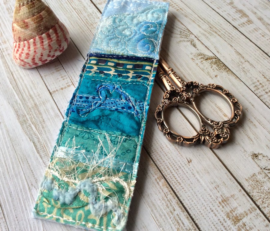 Embroidered up-cycled seascape bookmark. 