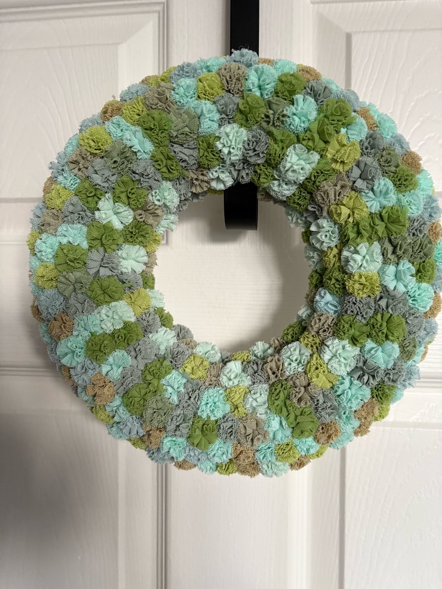 Greens scrunchy Pom Pom wreath. 