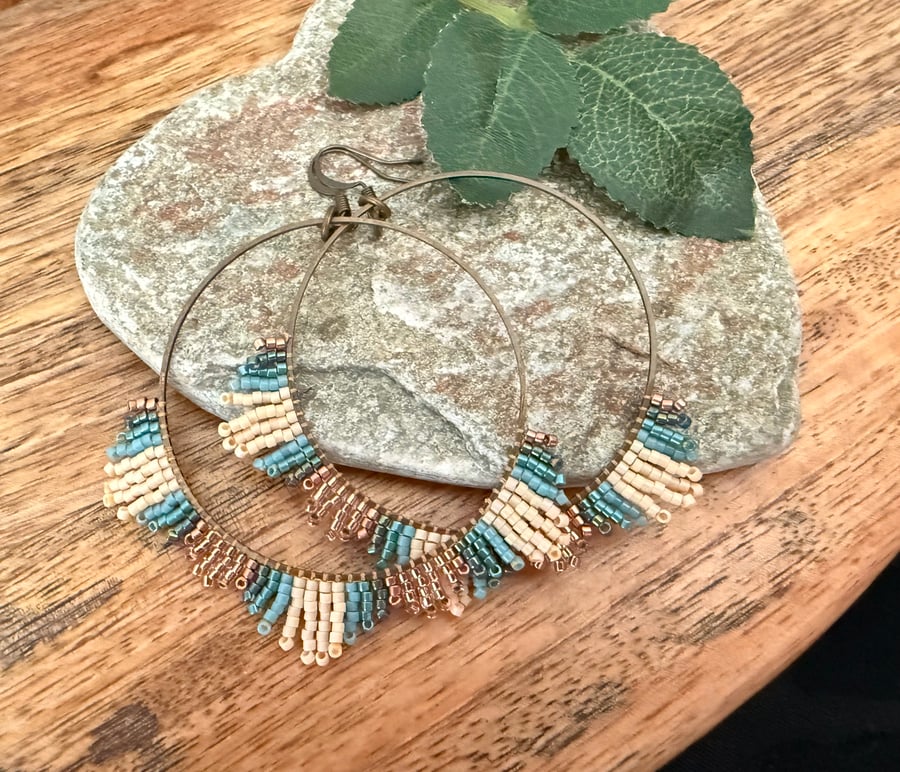 Large bohemian beadwork hoop fringe earrings in blue and bronze