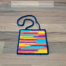 Wall art of blue, purple, yellow, and orange pattern, adjustable hang length