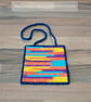 Wall art of blue, purple, yellow, and orange pattern, adjustable hang length