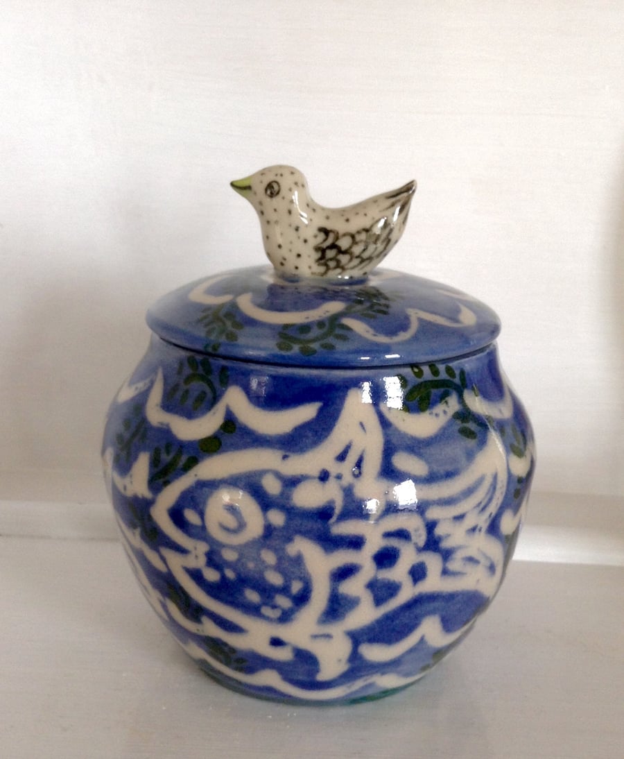 Decorative storage jar with bird lid
