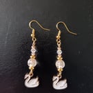 White and gold swan charm beaded dangle earrings 