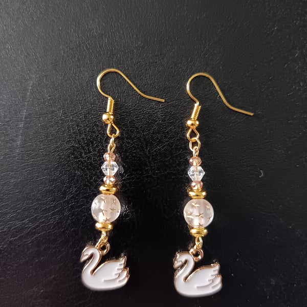 White and gold swan charm beaded dangle earrings 