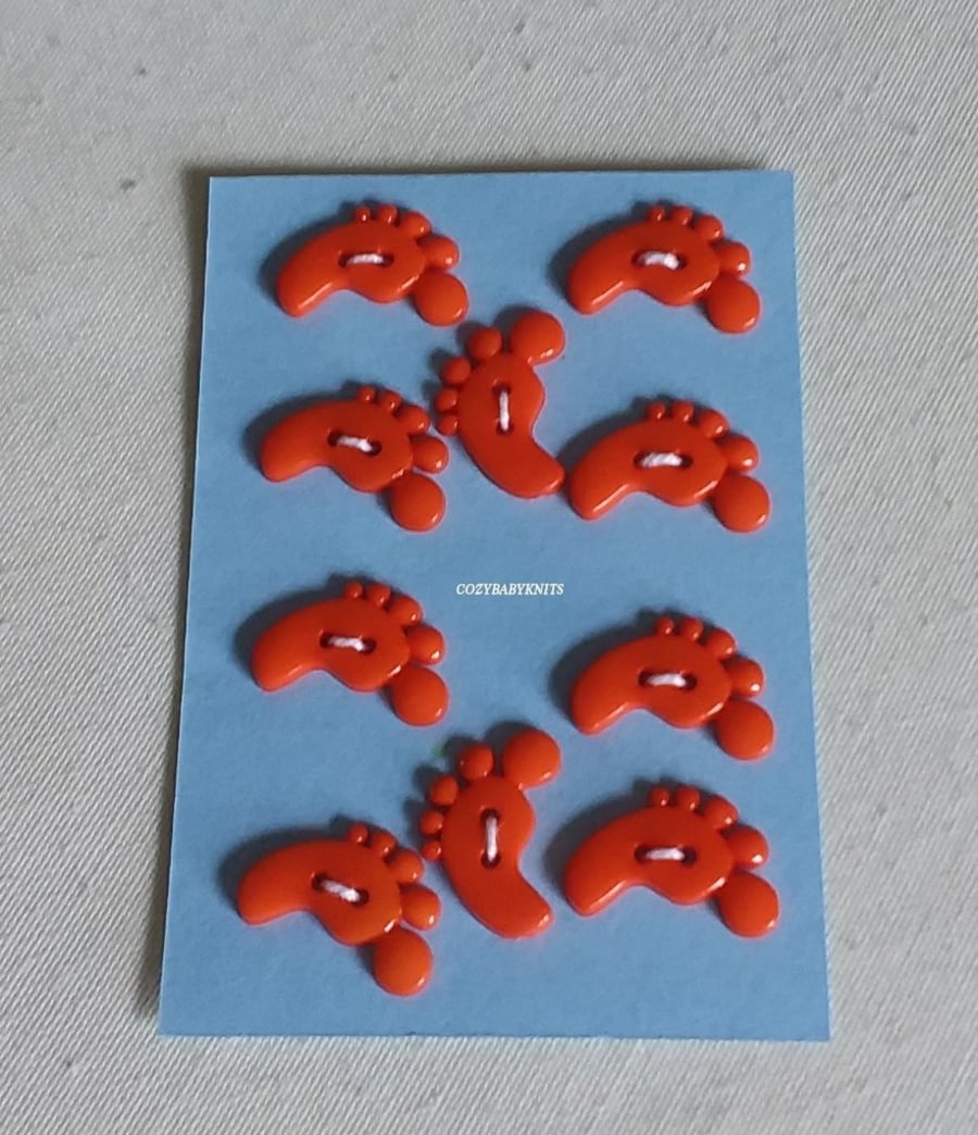 ORANGE FEET SHAPED BUTTONS WITH TWO HOLES FOR ATTACHING 
