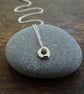 Tiny hagstone charm pendant - molten recycled silver