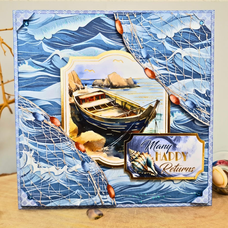 Sea themed birthday card with fishing row boat & sea waves, Many Happy Returns 