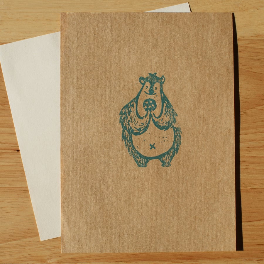 Cute bear with a cookie - handprinted linocut