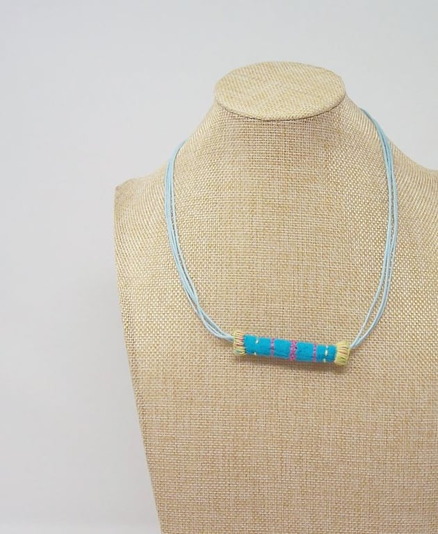 Embroidered fabric bead necklace with waxed cotton cord