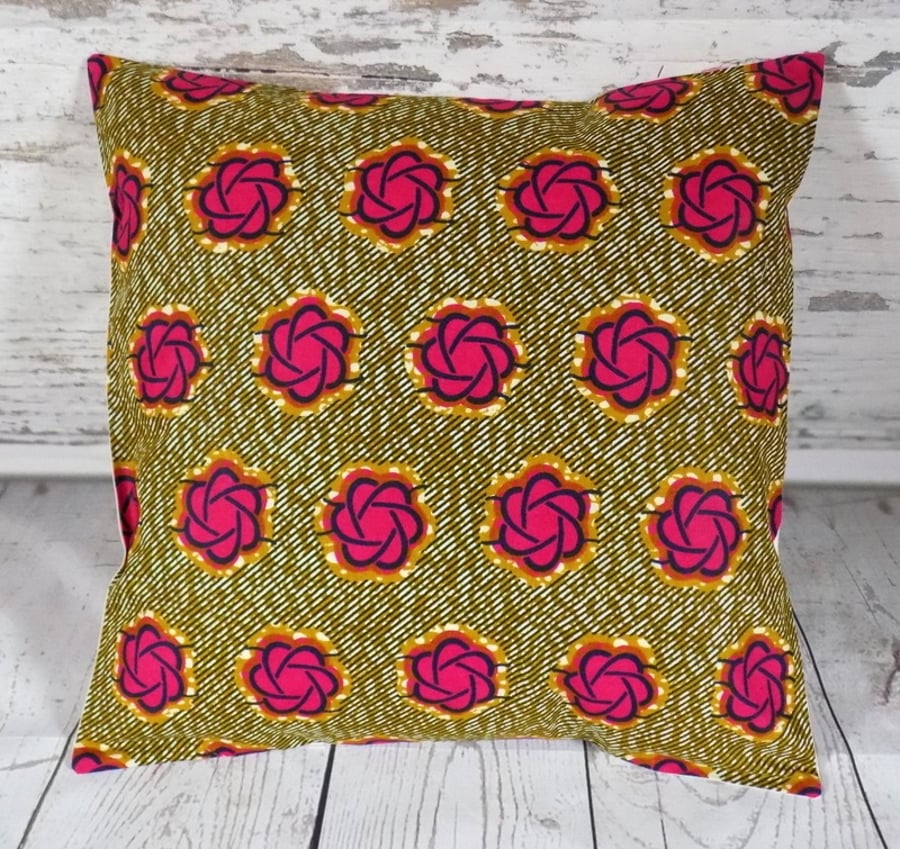 Cushion cover. African wax print in pink and indigo on khaki