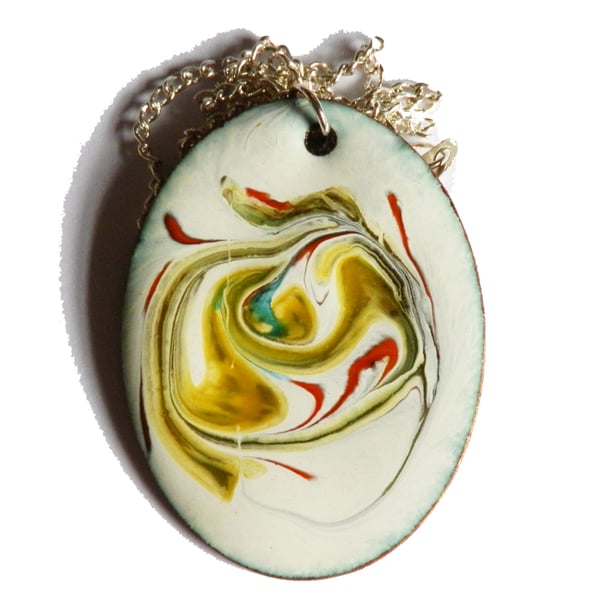 oval pendant - scrolled red, green, golden brown on white enamel