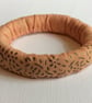Bangle, bracelet, fabric covered, slip on, peach with gold embossed pattern - Image 2