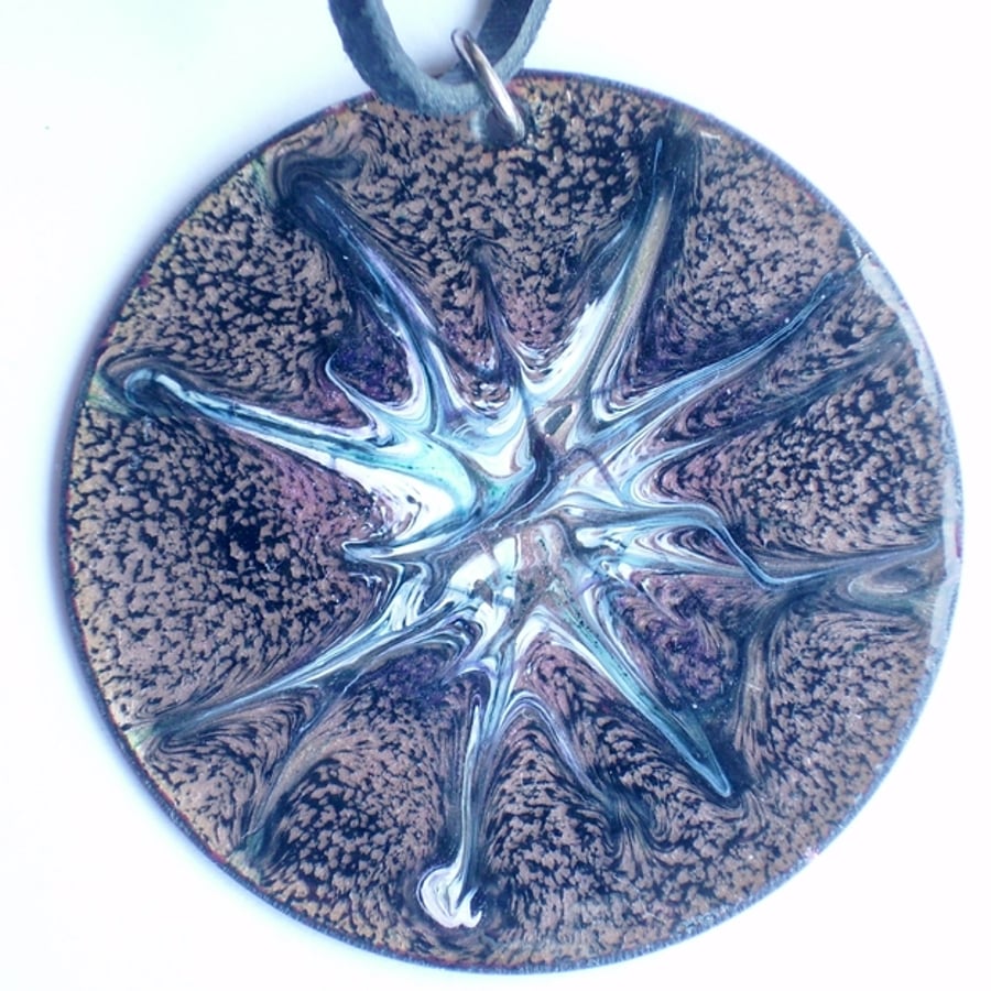 round pendant on thong - scrolled green, white, pink on black over clear enamel