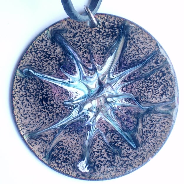 round pendant on thong - scrolled green, white, pink on black over clear enamel