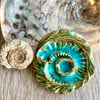 Turquoise crackle ammonite brooch