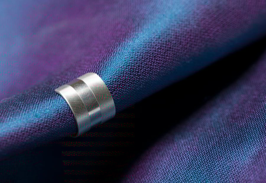 Chunky silver ear cuff with a two tone texture, brush matte and mirror polished