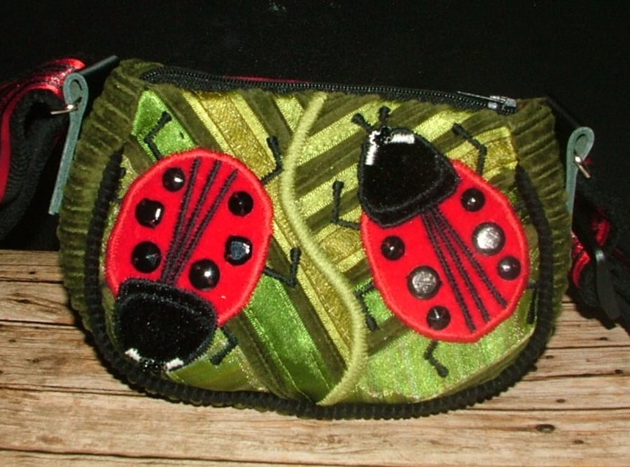 Green Ladybird purse with long adjustable strap