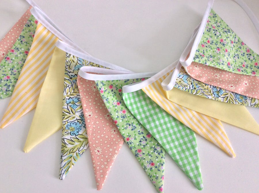 Floral bunting in citrus pastels with 12 flags