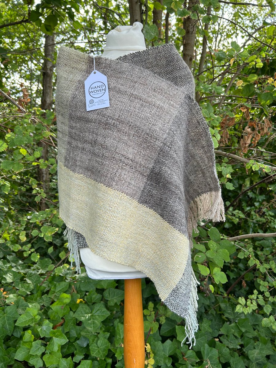 Handwoven, handspun scarf in shades of brown, grey, yellow, green and cream.