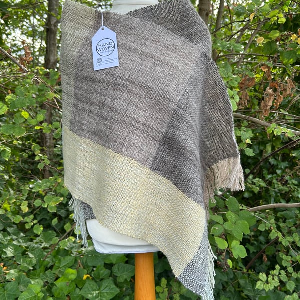 Handwoven, handspun scarf in shades of brown, grey, yellow, green and cream.