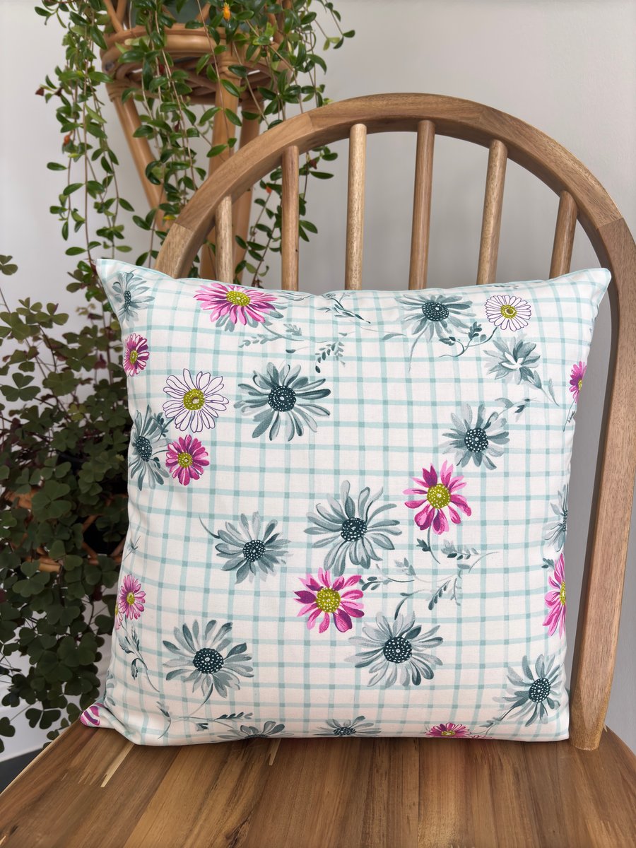 Floral cushion cover in a fresh, bright pink daisy print, 40cm x 40cm