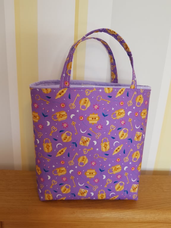 Reusable fabric gift bag; magic key on lilac