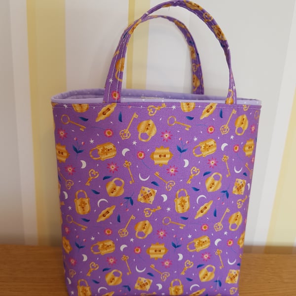 Reusable fabric gift bag; magic key on lilac