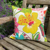 Bright floral cushion cover with gingham back