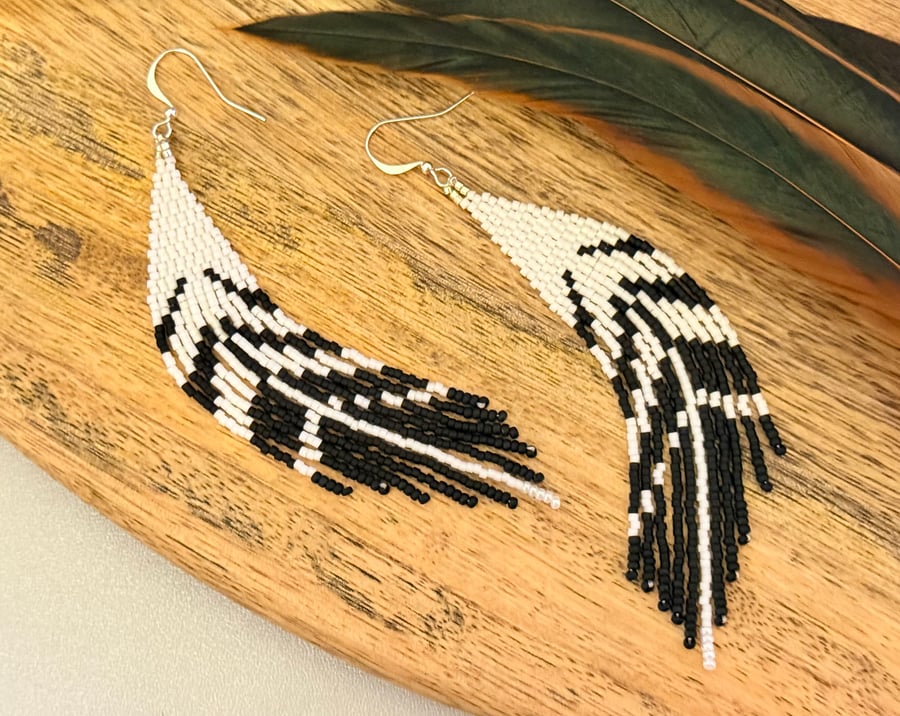 Black and white beadwork feather earrings