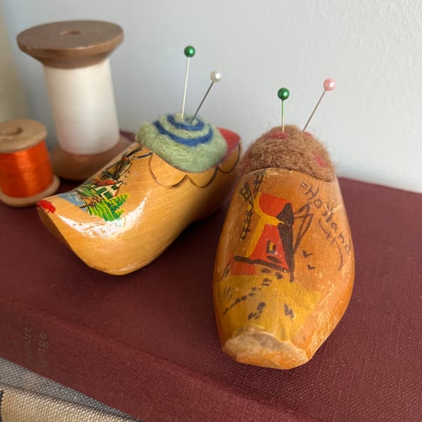Pair of pincushions in wooden souvenir clogs with needle felted cushions