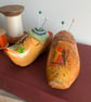 Pair of pincushions in wooden souvenir clogs with needle felted cushions