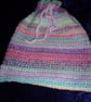 Crocheted Hot Water Bottle Cover - Image 1