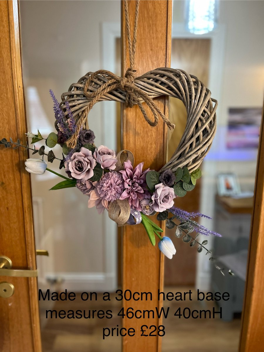 Lilac flowers on wicker heart wreath 