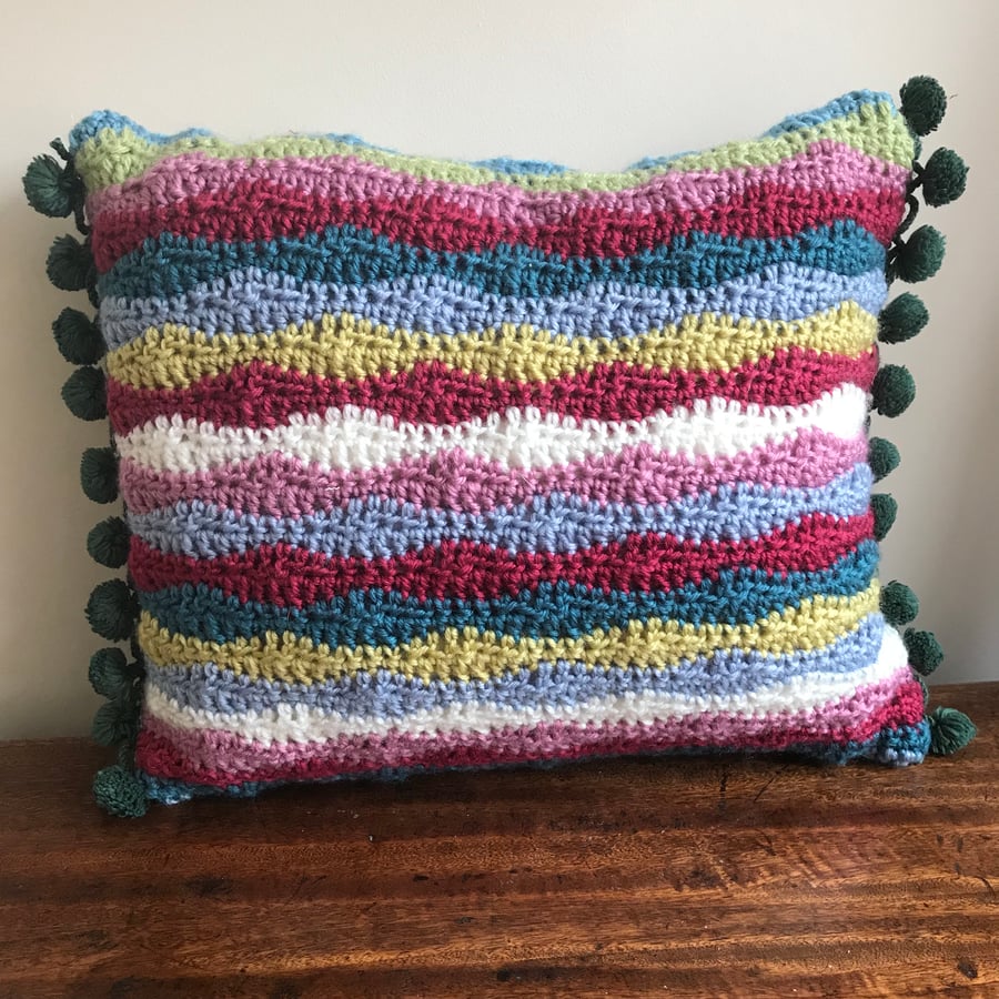 Striped crochet cushion with bobble trim