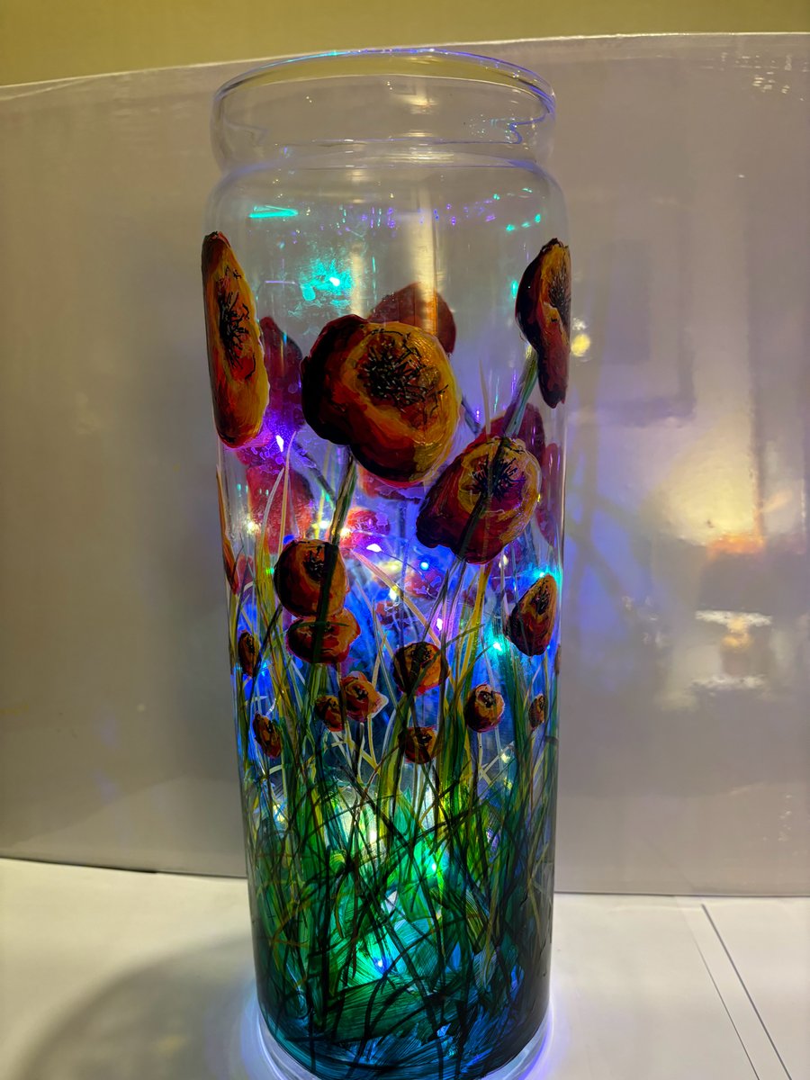 A large hand painted and fired glass vase by Andrew Jenkins 