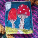 Felt and fabric machine embroidered toadstool brooch