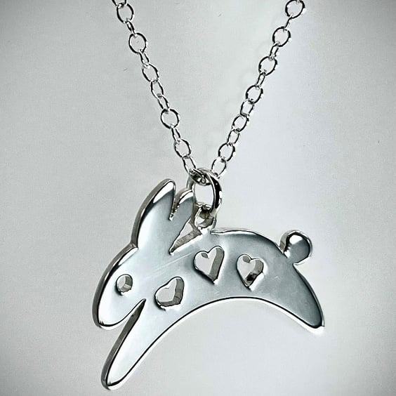Sterling silver leaping bunny rabbit with heart cutouts pendant necklace