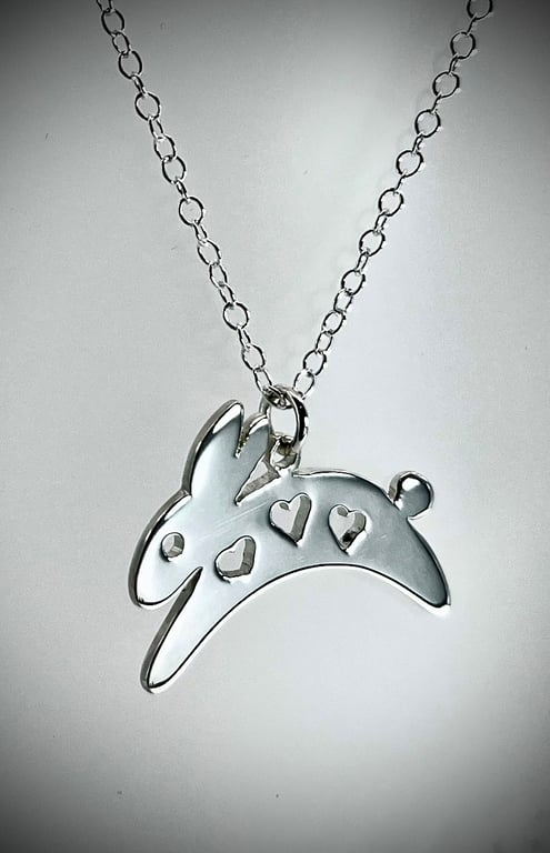 Sterling silver leaping bunny rabbit with heart cutouts pendant necklace
