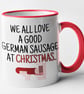 We All Love A German Sausage at Christmas Mug - Funny Novelty Christmas Mug Gift - Image 1