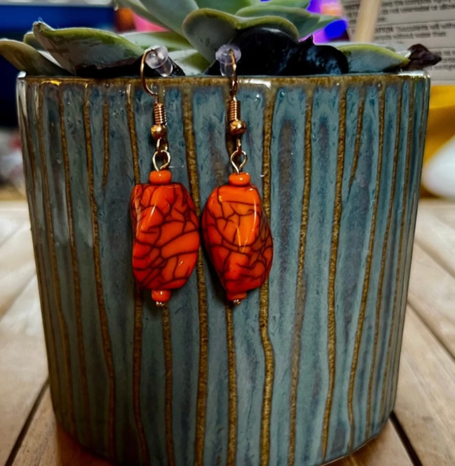 Orange crackled bead dangle earrings