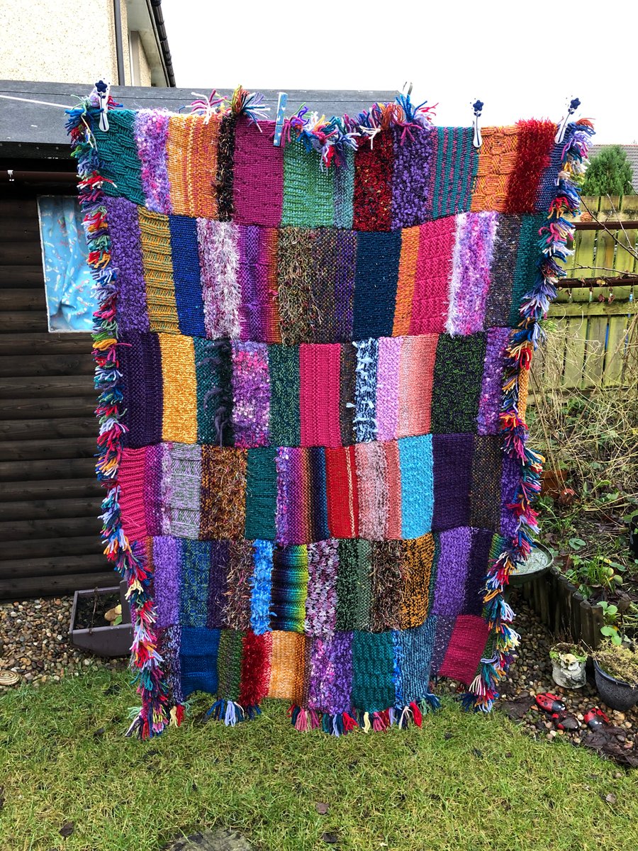 Multicoloured chunky hand knitted blanket