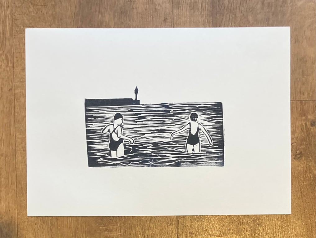 Sea swimming , hand printed lino print of sea swimmers 