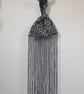 Snow leopard print faux fur fabric Japanese Knot bag with 48cm black tassel trim - Image 3