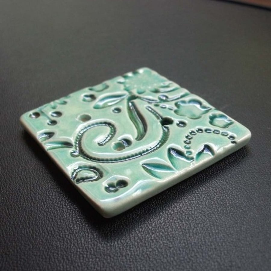 large turquoise ceramic button